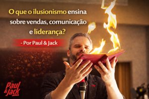 Palestrante realizando truque com livro em chamas durante apresentação, com o título “O que o ilusionismo ensina sobre vendas, comunicação e liderança? – Por Paul & Jack”.