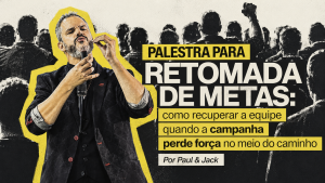 Paul em palestra sobre retomada de metas, diante de uma equipe, com destaque para recuperação de energia e direção comercial.